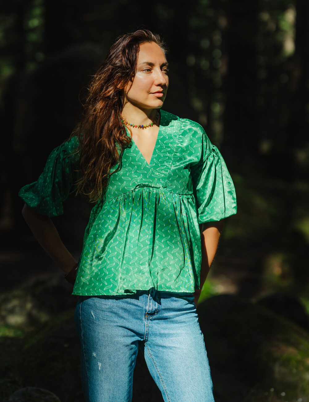 Model showcasing a vibrant green Chanderi top with a flowing design