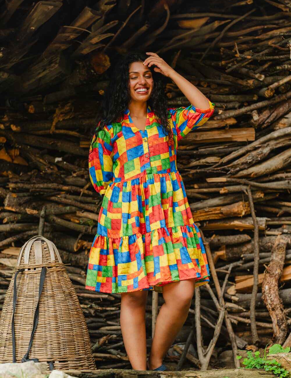 Model wearing a multi-colored, full-sleeve short dress in baby satin fabric, designed for both style and comfort.