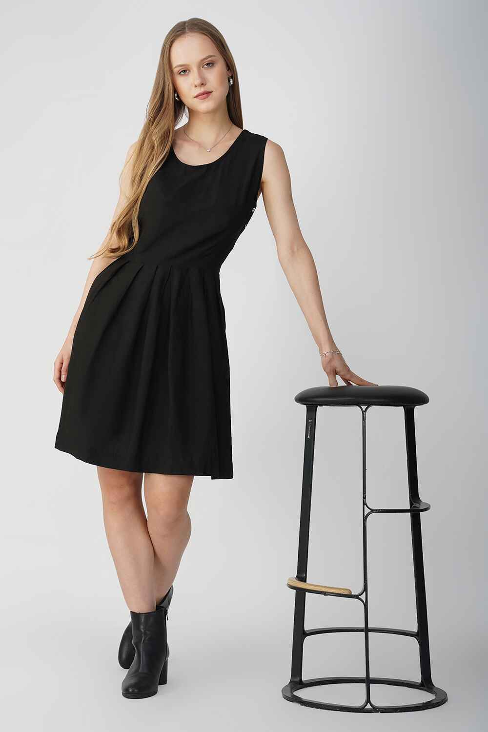 Model showcasing a chic black linen cotton short dress, perfect for casual, everyday wear.